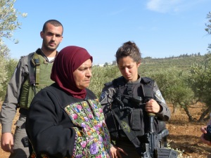 25 Nov 2013 Israeli Border Guard weeping as Palestinian trees destroyed_A.Morgan 